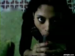 Like a ribald floozy, a fat Indian housewife swallows a huge 10-Pounder out of greed.